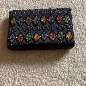 A black gemstone bag